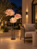 Dahlia Trio outdoor illuminated flower lamp at night, illustrative setting