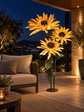 Sunflower Trio outdoor illuminated flower lamp at night, illustrative setting