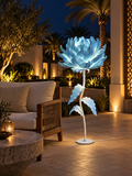 Magnolia outdoor illuminated flower lamp at night, illustrative setting