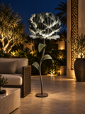 Peony outdoor illuminated flower lamp at night, illustrative setting
