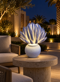 Flame Flower outdoor illuminated flower lamp at night, illustrative setting