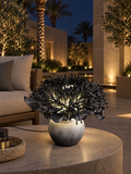 Giant Chrysanthemum outdoor illuminated flower lamp at night, illustrative setting