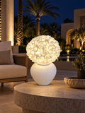 Hydrangea outdoor illuminated flower lamp at night, illustrative setting